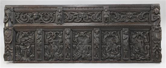 A 17th century Flemish carved oak coffer front, overall 5ft 7in. x 2ft 3in.